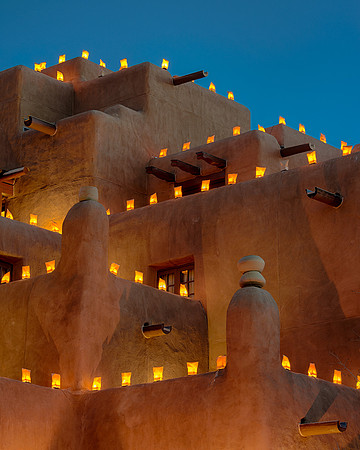 Luminaria on adobe building