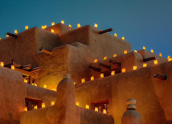 Luminaria on adobe building
