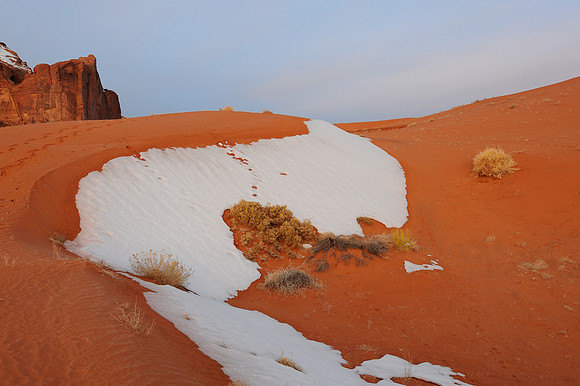 Snow on desert sand