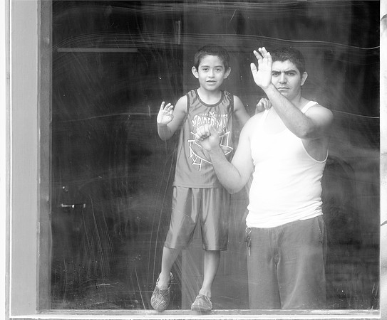 Behind glass