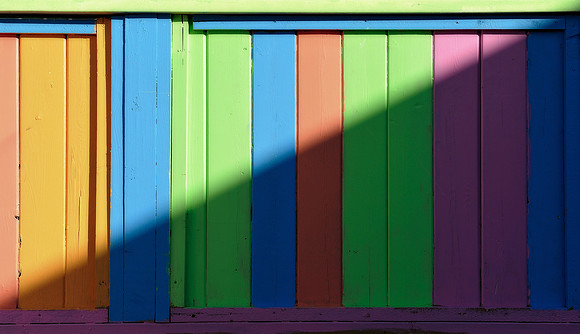 Shadow across fence