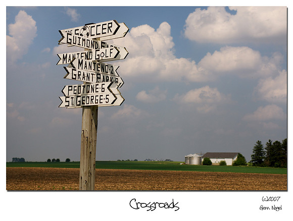 Crowded road sign in the middle of nowhere