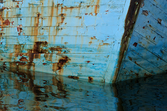 Blue boat reflections