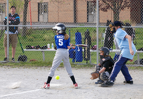 Danny looks on as Allison takes a pitch in the dirt
